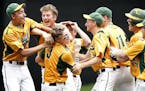 Brad Goulet (3) of New Life Academy celebrated with teammates after driving in the winning run in the bottom of the eighth inning of the Class 1A cham