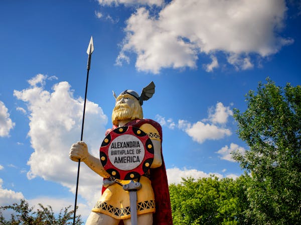 Big Ole, a 50-year-old wood and fiberglass Viking sculpture, towers near the Runestone Museum in Alexandria, Minn. Though he exudes strength, paint is