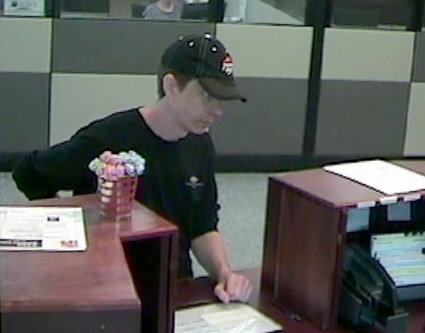 A surveillance image shows a suspect robbing a bank in Roseville.