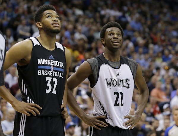 Minnesota Timberwolves forward Andrew Wiggins (22) and center Karl-Anthony Towns (32).