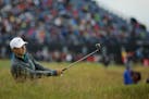 United States' Jordan Spieth plays a second shot from the 12th hole during the first round of the British Open Golf Championship at the Old Course, St