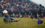 United States' Jordan Spieth plays a second shot from the 12th hole during the first round of the British Open Golf Championship at the Old Course, St