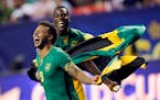 Jamaica�s Giles Barnes (9) and Je-Vaughn Watson (15) celebrate after Jamaica defeated the United States 2-1 in a CONCACAF Gold Cup soccer semifinal,