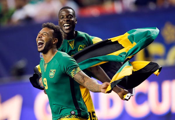 Jamaica�s Giles Barnes (9) and Je-Vaughn Watson (15) celebrate after Jamaica defeated the United States 2-1 in a CONCACAF Gold Cup soccer semifinal,