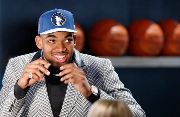 Karl-Anthony Towns reacts after being selected first overall by the Minnesota Timberwolves during the NBA basketball draft, Thursday, June 25, 2015, i