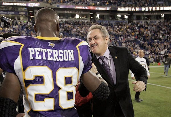 Zygi Wilf and Adrian Peterson in 2013.