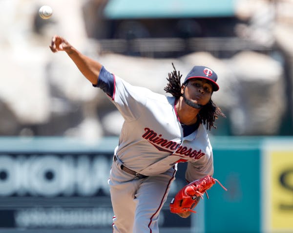 Minnesota Twins starting pitcher Ervin Santana throws against the Los Angeles Angels during the first inning of a baseball game in Anaheim, Calif., Th