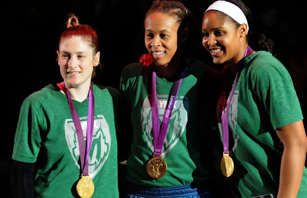 Lynx players, from left, Lindsay Whalen , Seimone Augustus and Maya Moore celebrated their 2012 gold medal with the U.S. women’s basketball team The