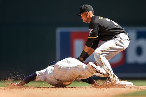 Pirates shortstop Pedro Florimon tagged out Twins third baseman Miguel Sano in the ninth inning on Wednesday.
