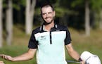 Troy Merritt celebrates winning the Quicken Loans National golf tournament at the Robert Trent Jones Golf Club in Gainesville, Va., Sunday, Aug. 2, 20