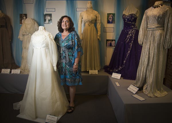 Lynn Rickert stood next to her wedding dress from 1970.