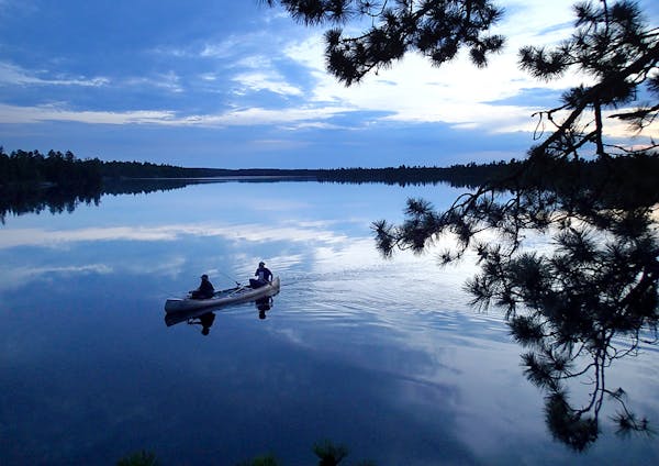 Two men paddle on Conmee Lake back to camp after an evening of fishing in Quetico Provincial Park earlier this month. Conmee Lake is one of the lakes 
