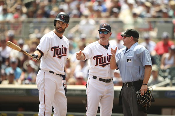 Joe Mauer and Paul Molitor weren’t pleased with umpire Mike Muchlinski after he called Mauer out on a swinging third strike in the first inning. The