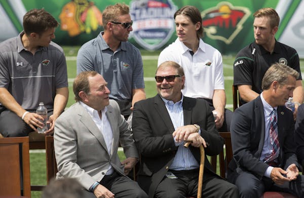 NHL Commissioner Gary Bettman, front left, chatted with Wild owner Craig Leipold during Wednesday’s news conference regarding the Stadium Series gam
