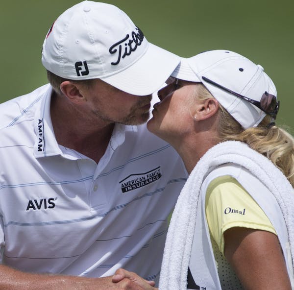 Steve Stricker kissed his wife and caddie, Nicki, after putting out on No. 18.