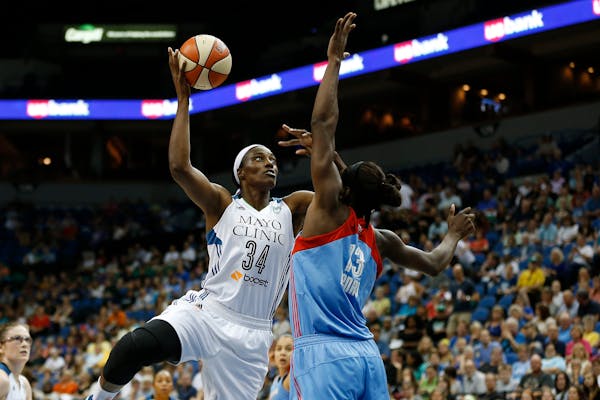 New Lynx center Sylvia Fowles shot over Dream forward Aneika Henry during the first half of Friday night's game at Target Center.