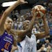 Minnesota Lynx center Sylvia Fowles (34) drives against Phoenix Mercury center Brittney Griner (42) during the first half of a WNBA basketball game, S