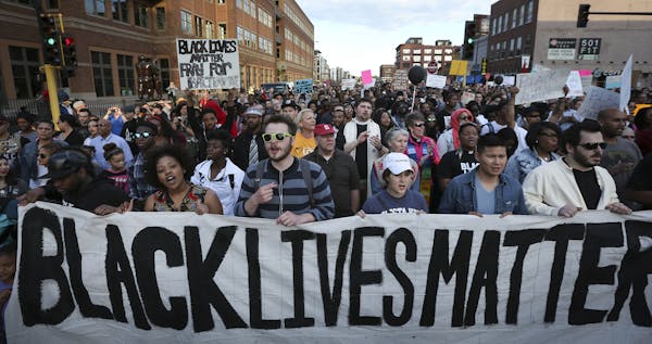 Protesters walked along Washington Avenue during a Black Lives Matter rally on April 29, 2015, in Minneapolis.