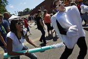 At the 40th annual Grand Old Day in St. Paul, a crowd of over 250,000 people were in attendance. Tiffany Bentford of Lichtfield gave Jay Schlie a brus