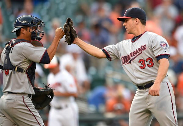 Milone gets first major league save