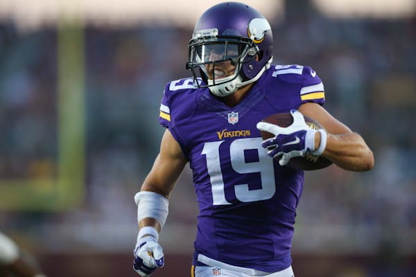 Vikings wide receiver Adam Thielen looked for the goal line after catching a short pass and going 15 yards for a second-quarter touchdown at TCF Bank 