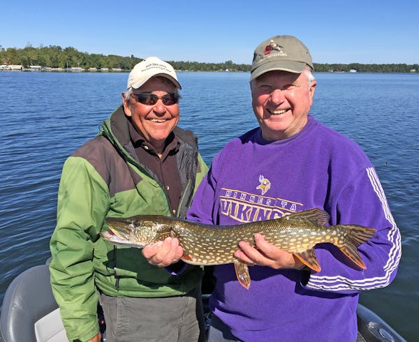 Brainerd-Nisswa area fishing guide Marv Koep, left, with the Rev. Mike Arms, a regular walleye-angling partner and retired Catholic priest who moved f