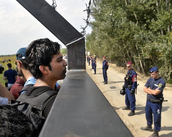 in no man’s land: Migrants found themselves trapped on the Serbian side of the border with Hungary on Tuesday after Hungary sealed its border.