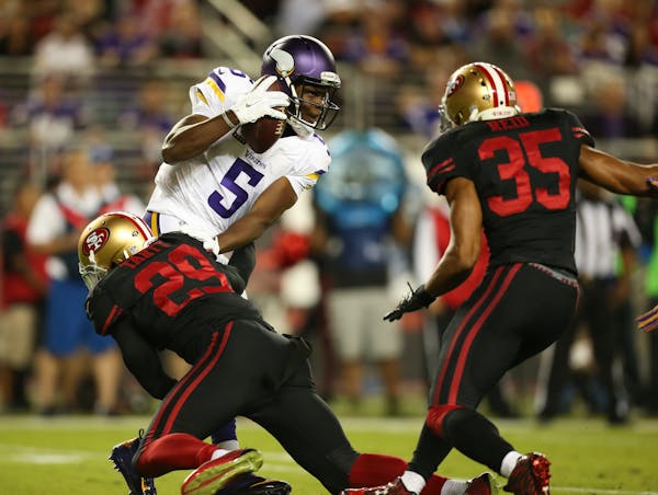 Vikings quarterback Teddy Bridgewater is sacked for a 14-yard loss by San Francisco 49ers strong safety Jaquiski Tartt during the first quarter.