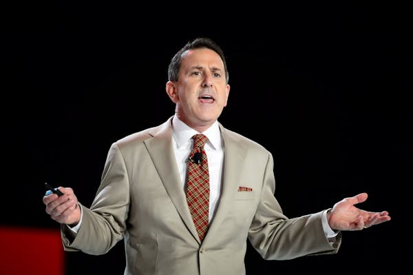 Target executives lowered their outlook as comparable sales fell during its second fiscal quarter. File photo of Target CEO Brian Cornell at a company