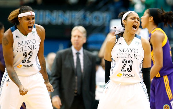 Rebekkah Brunson (32) and Maya Moore (23) of the Lynx react after a turnover by the Sparks in the final minute of Tuesday's game. Minnesota beat Los A