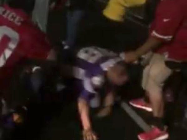 In a video posted to Facebook, a man wearing a Vikings jersey is kicked and beaten outside the San Francisco 49ers' stadium on Monday, Sept. 14, 2015