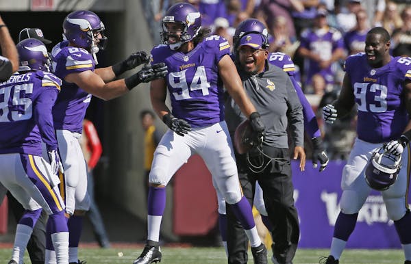 Vikings DE Justin Trattou (94) got a rare chance to celebrate after his fourth-quarter interception last Sunday against the Lions.