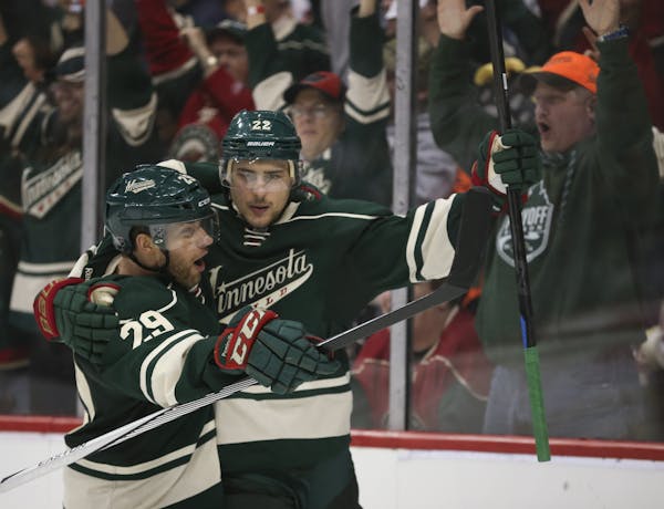Minnesota Wild right wing Nino Niederreiter (22) was congratulated by Jason Pominville (29) after he scored an empty net goal in the third period last