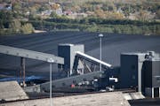 Stockpiled coal at Xcel Energy's Sherco plant in Becker, Minn. The utility is planning to retire two of three coal burners, replacing them with a gas-