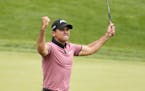 Jason Day, of Australia, celebrates his eagle putt on the 18th green during the second round of the BMW Championship golf tournament at Conway Farms G