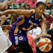 Los Angeles Sparks star Candace Parker dribbled around Lynx forward Asjha Jones when the Lynx and Sparks played on July 29.