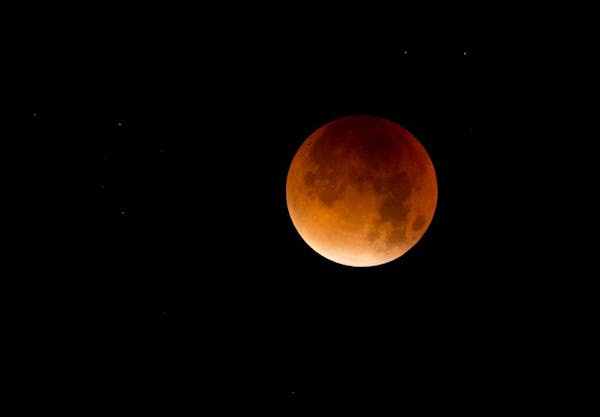 A so-called supermoon is seen at the start of a lunar eclipse above Lisbon in the early hours of Monday, Sept. 28, 2015. Supermoon, or perigee moon, i