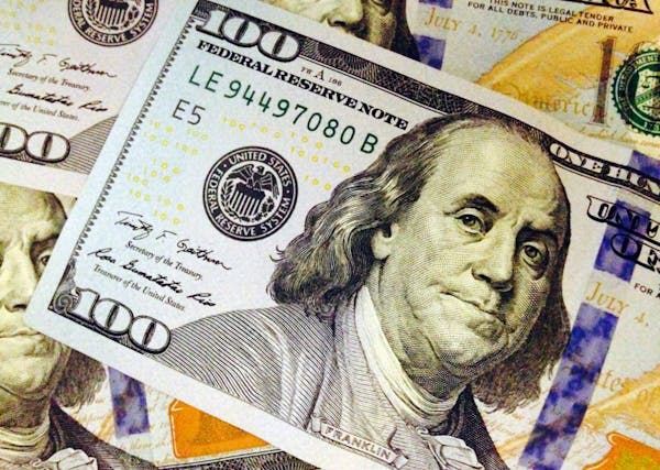 FILE - This Feb. 2, 2015, file photo, depicts a part of a U.S. $100 bill. Older Americans got a double dose of bad news Thursday: There will be no cos