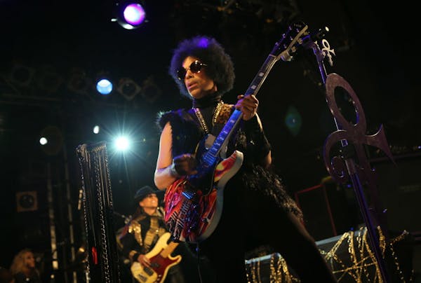 This photo taken on Tuesday Feb. 5, 2014 and released by 3RDEYEGIRL NPG Records on Wednesday Feb. 5, 2014, shows Prince performing in London.