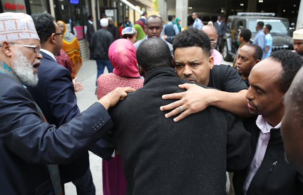 Abdirahman Mohamed, of Nashville, son of shooting victim Abdi Haji Mohamed Liiban, received hugs and support from community members after making the 1