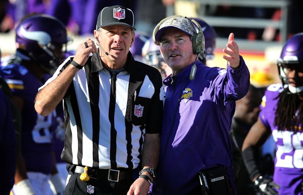 Vikings head coach Mike Zimmer talked with side judge Scott Edwards in the fourth quarter Sunday November 8, 2015.