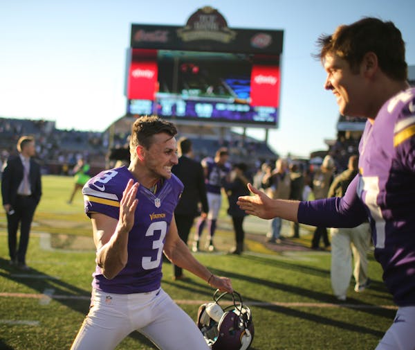 Vikings kicker Blair Walsh (3) celebrated his game winning field goal with Vikings long snapper Kevin McDermott Sunday afternoon.