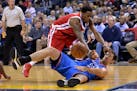 Thunder forward Nick Collison, bottom, passed the ball while on his back against the defense of Grizzlies guard Mario Chalmers in the second half Mond