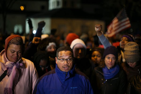 Congressman Keith Ellison and other elected officials spoke at a news conference across the street from the 4th Precinct headquarters Thursday night i