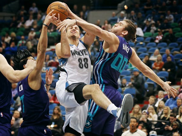 Timberwolves forward Nemanja Bjelica was fouled by Hornets forward Spencer Hawes during Charlotte's 104-91 victory at Target Center on Tuesday night.