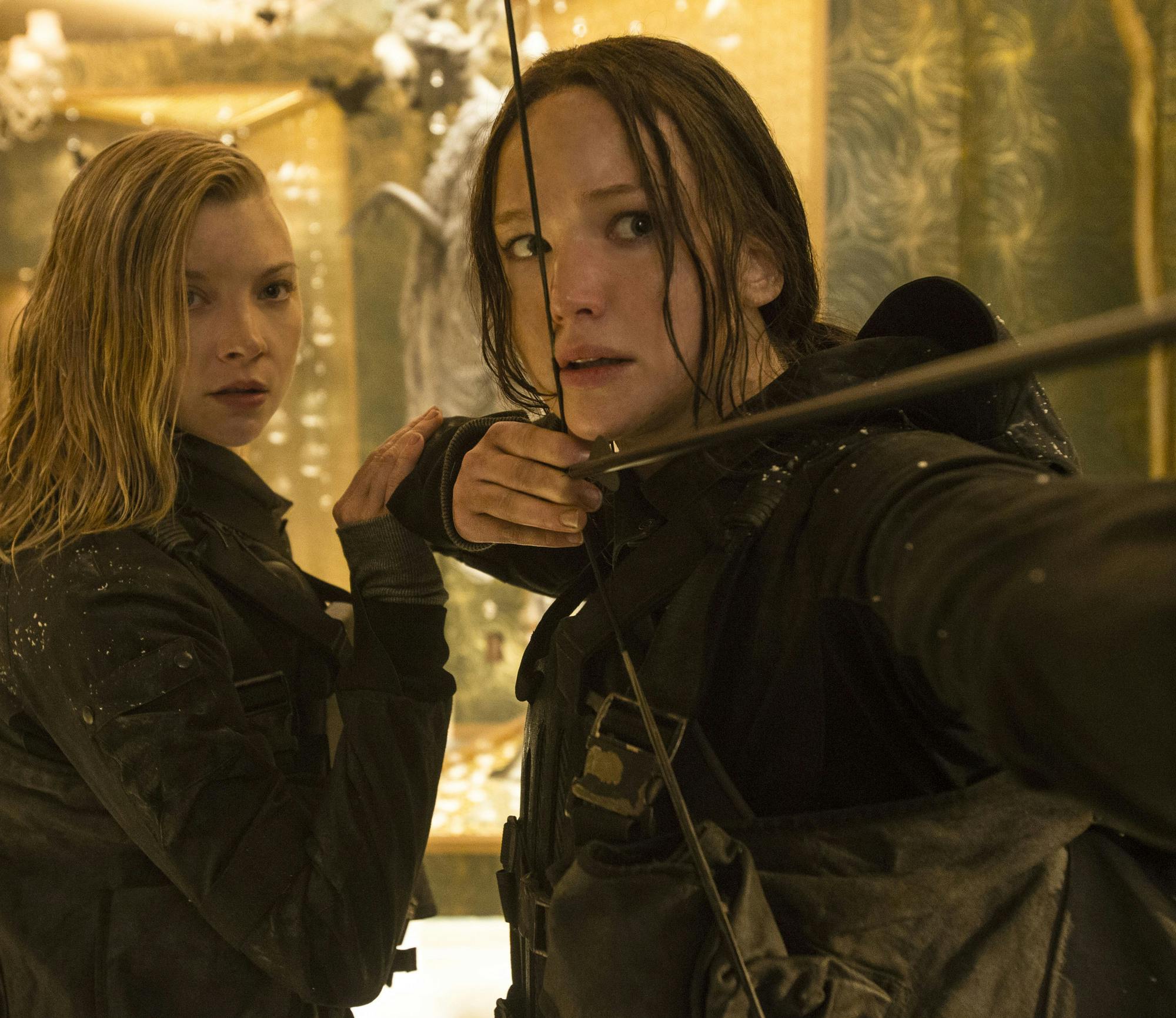 Cressida (Natalie Dormer, left) and Katniss Everdeen (Jennifer Lawrence, ri...