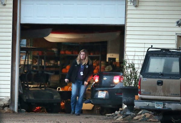 A police car was driven into a garage Wednesday near Herman, Minn., where it appeared that Gianna and Samantha Rucki were loaded into it. The girls ha