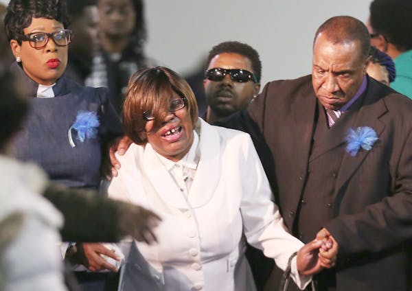 Irma Burns, Jamar Clark’s mother, was escorted from her son’s casket during his funeral service Wednesday.