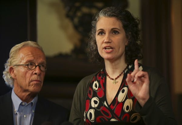 Attorney Jeff Anderson with plaintiff Laura Adams during a news conference at his office in St. Paul Tuesday afternoon.