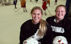 Taylor Turnquist left and Alyssa Hansen posed for a portrait during practice at Fogerty Arena Monday November 17, 2015 in Blaine, MN. ] Coon Rapids gi